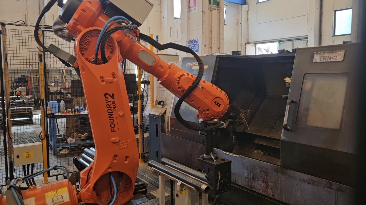 ABB Foundry Plus 2 robot loading a lathe with tubular bars